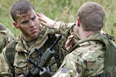 U. K. Army Reservists Applying Camouflage; Photo by Lt. Col John Skliros/MOD